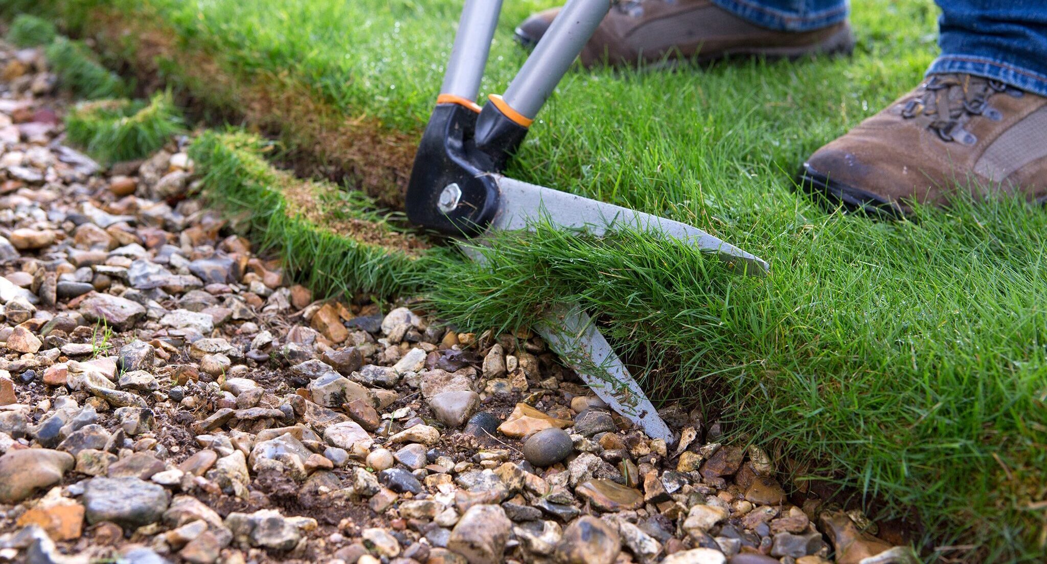 Edging lawn with edging shears standing on grass with gravel path in foreground trim trimming cut cutting 16/10/14 16/10/2014 161014 16102014 16 16th October 2014 Autumn Chawton House Alan Titchmarsh photographer Sarah Cuttle practical seasonal tasks maintenance step by step